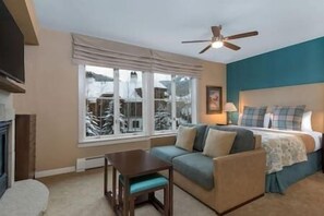 Bedroom with a plush king bed and sleeper sofa