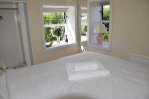Double bedroom with double aspect views of the gardens and ensuite wet room
