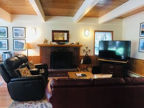 Sea Pines Living Area With Wood Burning Fireplace - Sea Pines living area with wood burning fireplace.