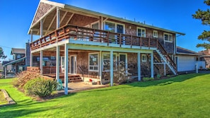 Sand Pads Exterior and First Floor Deck - Exterior showing first floor deck and entry.
