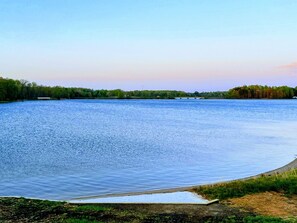 Our backyard and private beach provide a serene lakeside escape with a tranquil view, perfect for relaxation and connecting with nature