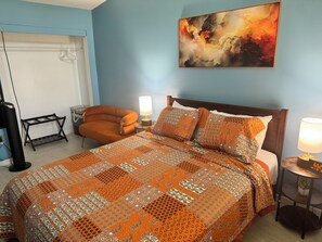 This modern room has a comfortable queen sized bed located on the ground level.