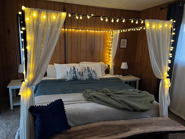 Beautiful king size poster bed with memory foam mattress in the upstairs bedroom