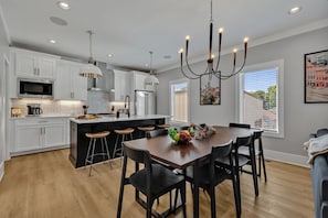 2nd Floor: Formal dining area featuring a large table set to accommodate 8 guests.