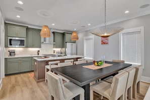 2nd Floor: Formal dining area featuring a large table set to accommodate 8 guests.