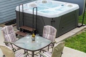 5 person hot tub with outside seating area