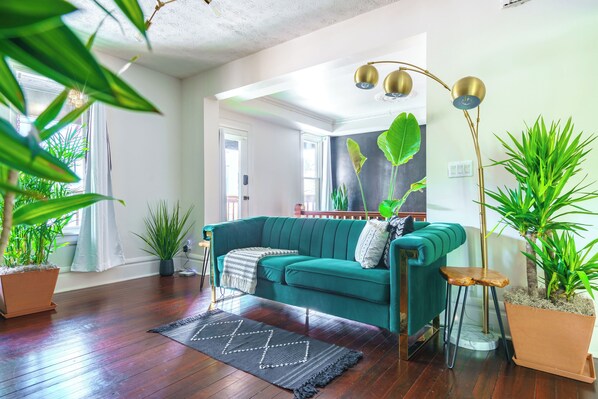 Enjoy a tranquil retreat with high-end fixtures and a jungle theme, Enjoy our spacious, modern, and uniquely styled deluxe living room with smart home features