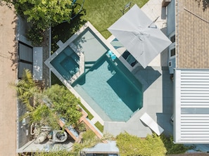 Heated pool with endless swim machine and spa. 