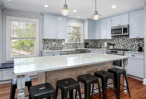 Fully equipped kitchen, with bar seating