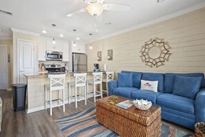 Updated with a cool, coastal vibe! Sleeper sofa in living room.
