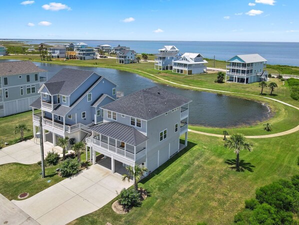 Wait until you witness the gorgeous sunset over the bay!
Sunny Side Up is the corner house in the photo.