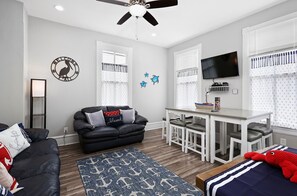 Downstairs living area with plenty of seating!  Gather for a good movie or games at the table.