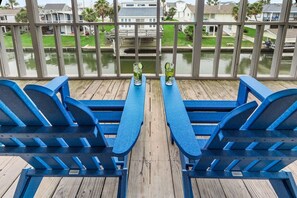 Enjoy the views with your favorite person on the oversized screened porch.
