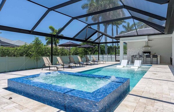 Tropical Pool Oasis with Falling Waterfall and Jacuzzi