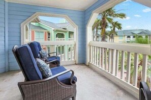 Enjoy the gentle breeze over looking the pool and beyond to fantastic ocean view!