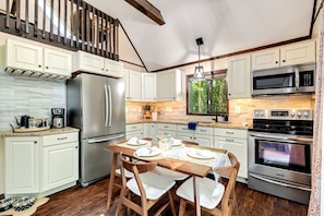 Kitchen with granite countertops and modern appliances