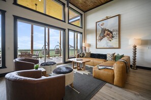 Enjoy the expansive open concept living, dining, and kitchen with some fun and lux Western flair a la Annie Oakley