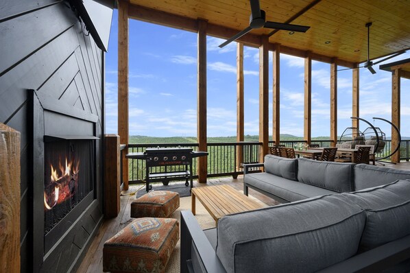 Enjoy the expansive back decks with seating, fireplaces, TVs, Blackstone Griddle, hot tub, & sauna!