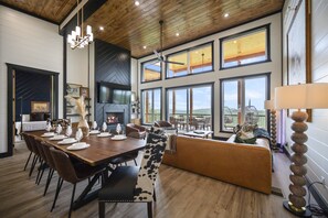 The custom live edge dining table invites everyone to gather round and enjoy time together and take in the amazing mountain views