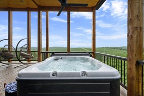 Enjoy the hot tub surrounded by amazing mountain views.