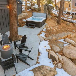 Hot tub  and fire pit with lake view.