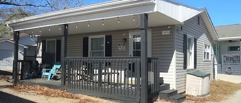 Exterior of House - porch with 3 chairs and 2 rocking chairs, sand toys, 4 beach chairs. It's the perfect spot to sip hot coffee and enjoy the morning breeze!