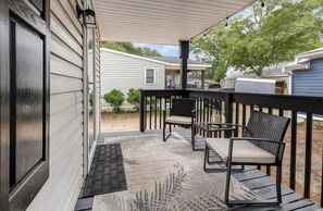 Exterior of House - porch with 3 chairs and 2 rocking chairs, sand toys, 4 beach chairs. It's the perfect spot to sip hot coffee and enjoy the morning breeze! 