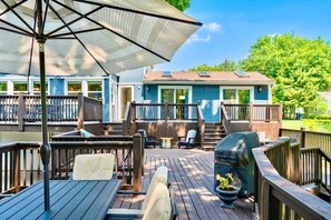 Outdoor Oasis: Expansive deck with grill, fire pit, hammock, and delightful dining spots!