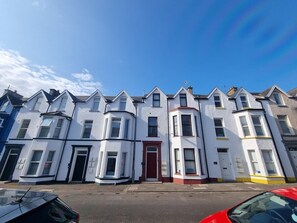 The apartment is nestled only a short stroll away from the beach.