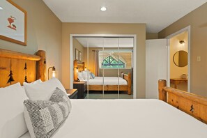 Primary bedroom with a queen bed and storage