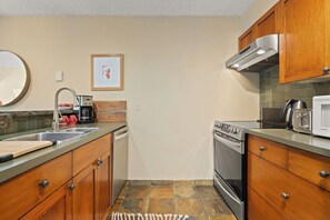 Well-equipped kitchen with contemporary appliances, including a dishwasher