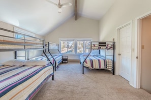 Triple the fun! These comfy bunk beds offer sleeping space for the whole crew.