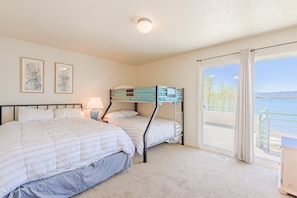 Room with a view! Queen bed, bunk bed & balcony access.