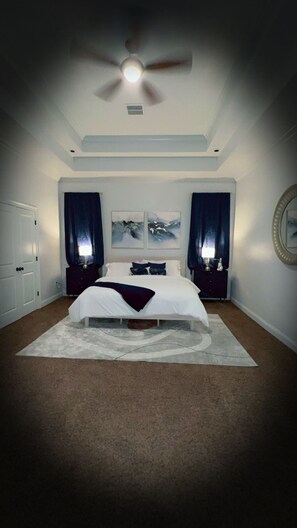 Primary bedroom with navy blue decor!