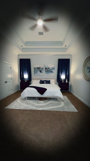 Primary bedroom with navy blue decor!