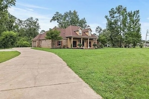 Long driveway with two car garage for parking.
