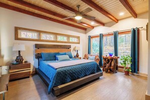 Bedroom with beams on the ceiling