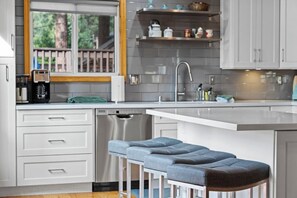 Kitchen area with barstool seating