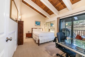 Bedroom 1: Queen bed, work desk and chair, access to balcony, en-suite bath, main floor