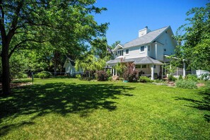 Mature trees, badminton, hot tub, & seating galore. Plenty of room for the pup!