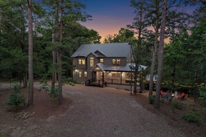 Welcome to Mountain Home. Enjoy the convenience of our spacious circular driveway, perfect for parking your boat and ATV trailers with ease.
