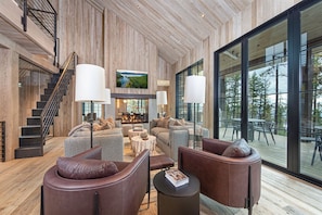 The living room features a lofted living area with sleeper sofa.