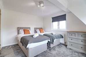 The room has ample storage, and the windows bring natural light that uplifts your mood