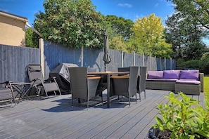 The glorious backyard is perfect for relaxing under the stars or enjoying a BBQ