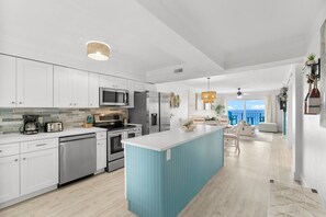 Whip up a delicious snack or a full meal in our bright, coastal kitchen while enjoying an open view to the ocean! Let the natural light dance on your countertops as you explore your culinary creativity amidst the soothing backdrop of crashing waves.