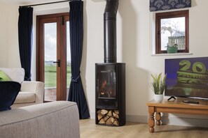 Wood burning stove in the sitting room for cooler evenings
