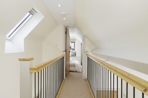 Open landing leading to the bedroom and overlooking the entrance hall
