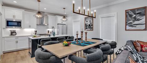2nd Floor: Formal dining table between the living room and kitchen offering a large table to accommodate 8 guests.