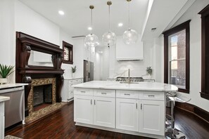 Whip up a chef's meal in the large kitchen with a dual oven range and 8 burners!