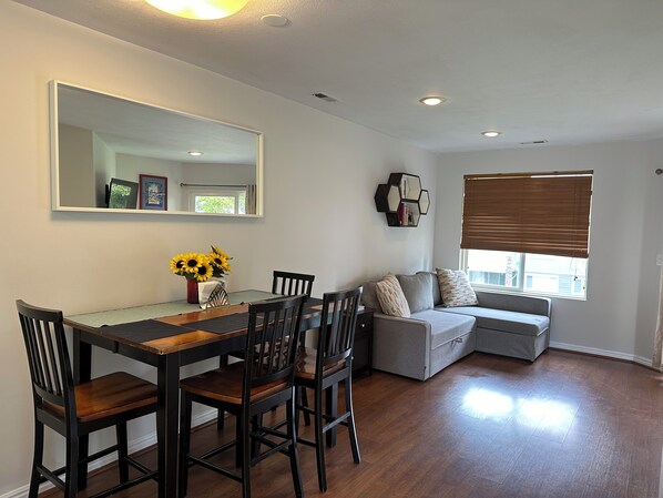 Dining area and living space couch.